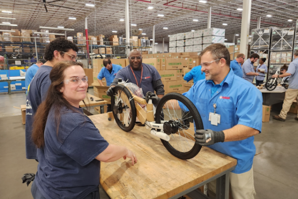 Yamaha Team Members assemble Strider bikes for 3 local schools